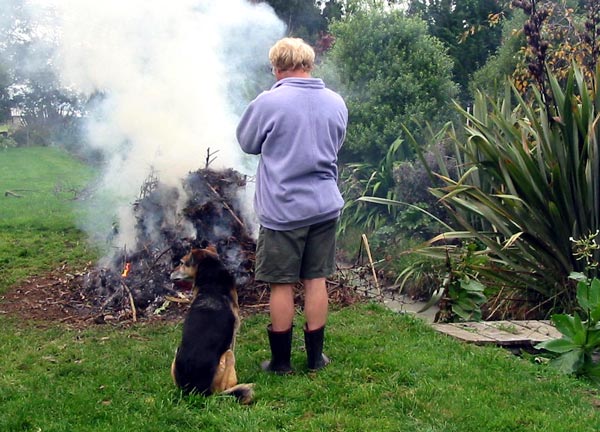  Stephen and Taj-dog inspect the rubbish fire. 